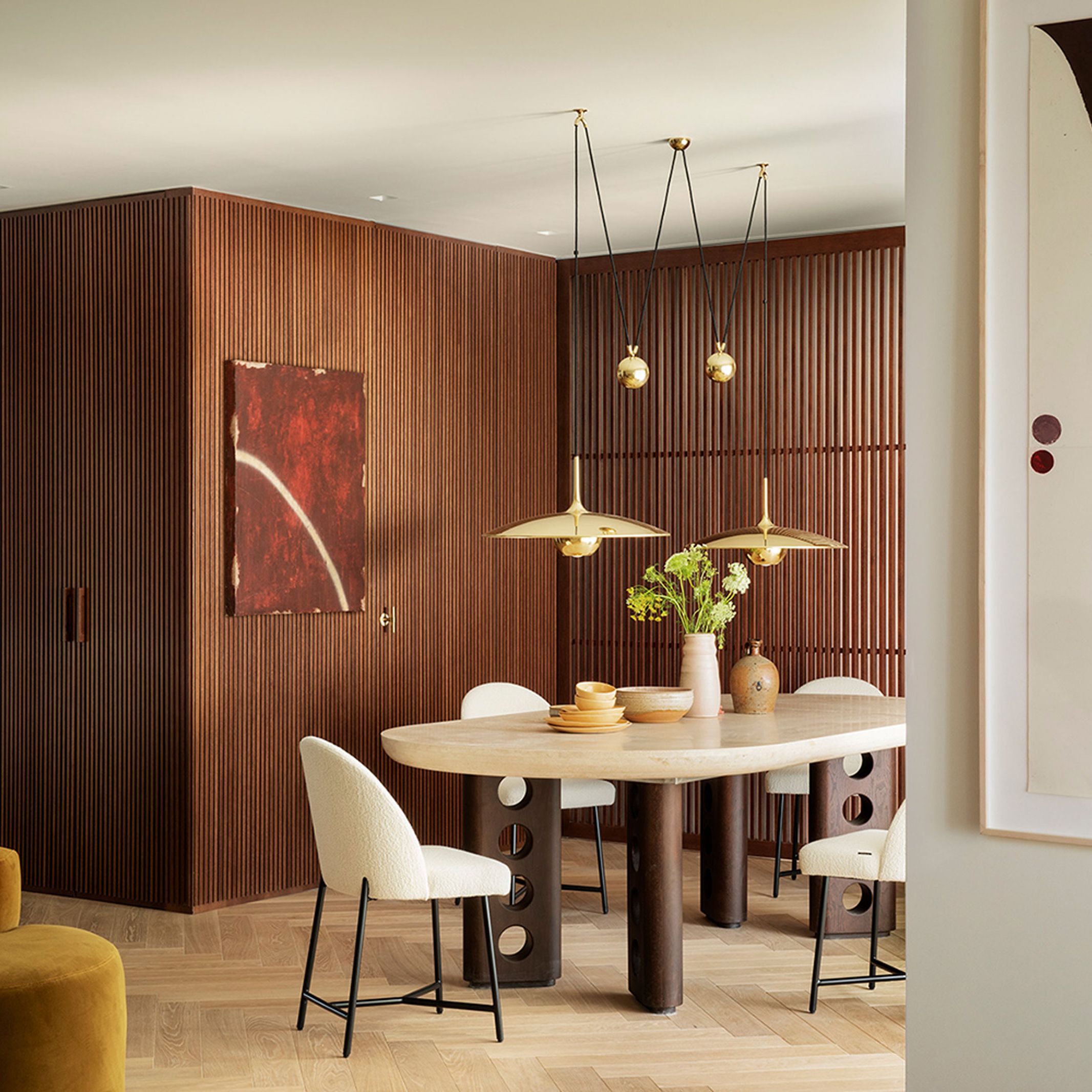 Bedroom wall with rich texture and a curated art display.