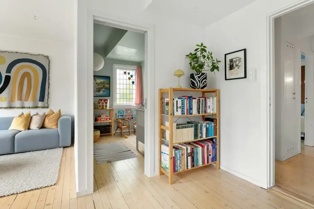 Layered lighting design showing recessed lights, pendant, and floor lamp